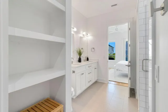 a bedroom with a bed and glass wall