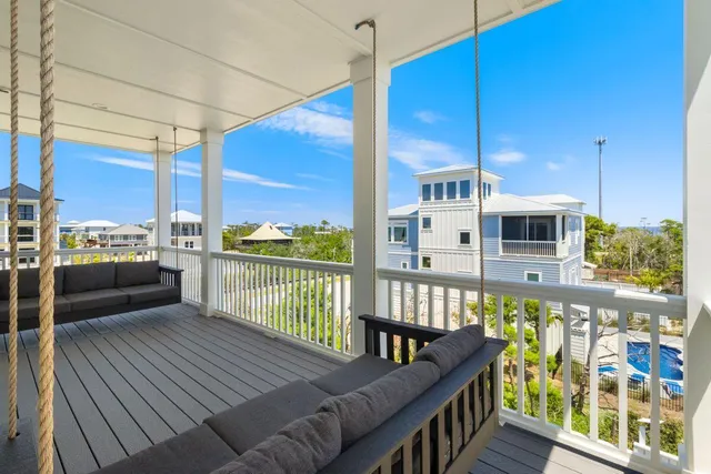 a house view with a sitting space garden and patio