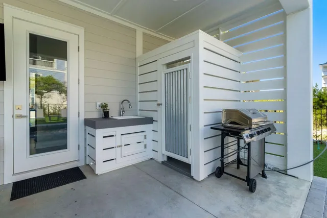 a aerial view of a house with a garden and lake view