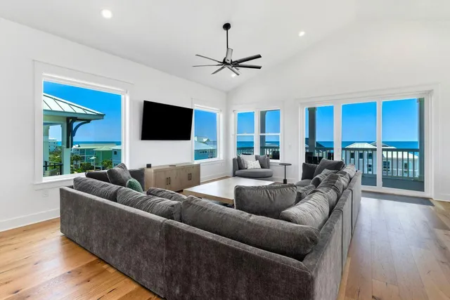 a living room with furniture kitchen area and a view of living room
