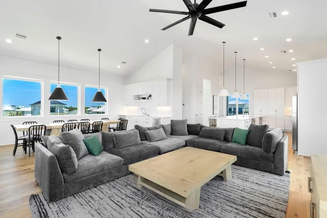 a kitchen with stainless steel appliances kitchen island granite countertop a sink and cabinets