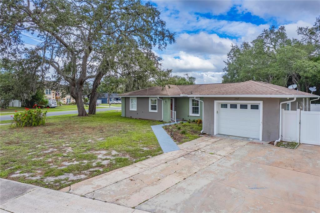 7367 Gates Circle Spring Hill, FL 34606 - Photo 2 of 31 front view of a house with a yard