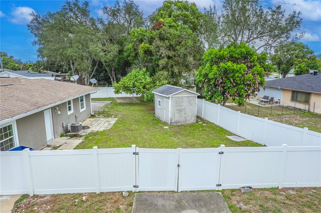 7367 Gates Circle Spring Hill, FL 34606 - Photo 21 of 31 a view of a house with backyard and sitting area