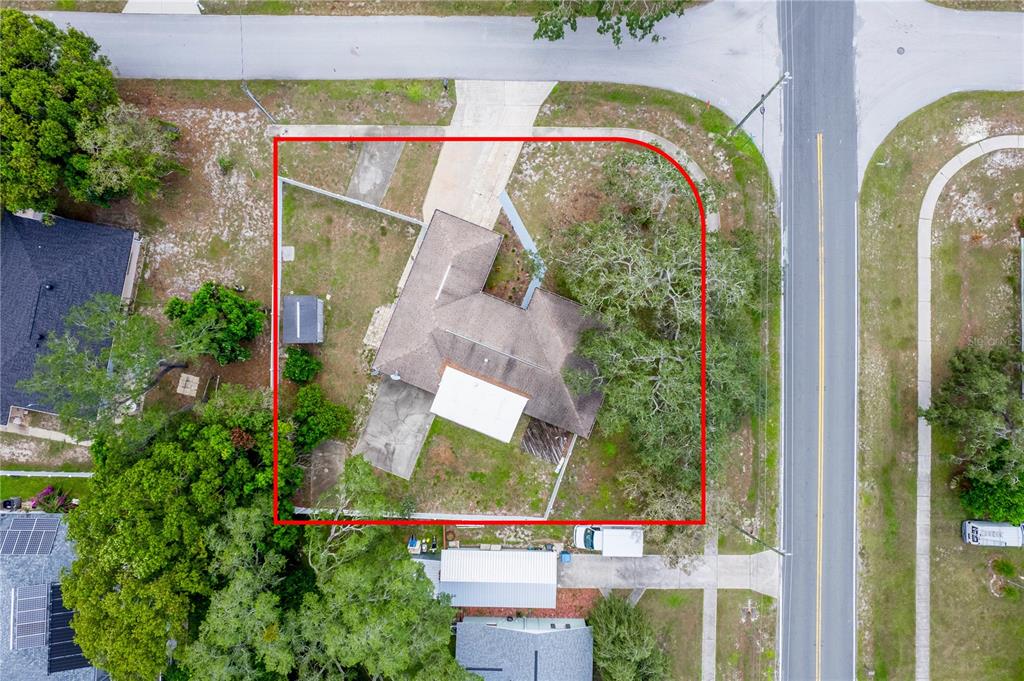 7367 Gates Circle Spring Hill, FL 34606 - Photo 25 of 31 an aerial view of a house with swimming pool and garden