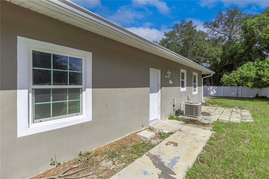 7367 Gates Circle Spring Hill, FL 34606 - Photo 27 of 31 a front view of a house with a yard