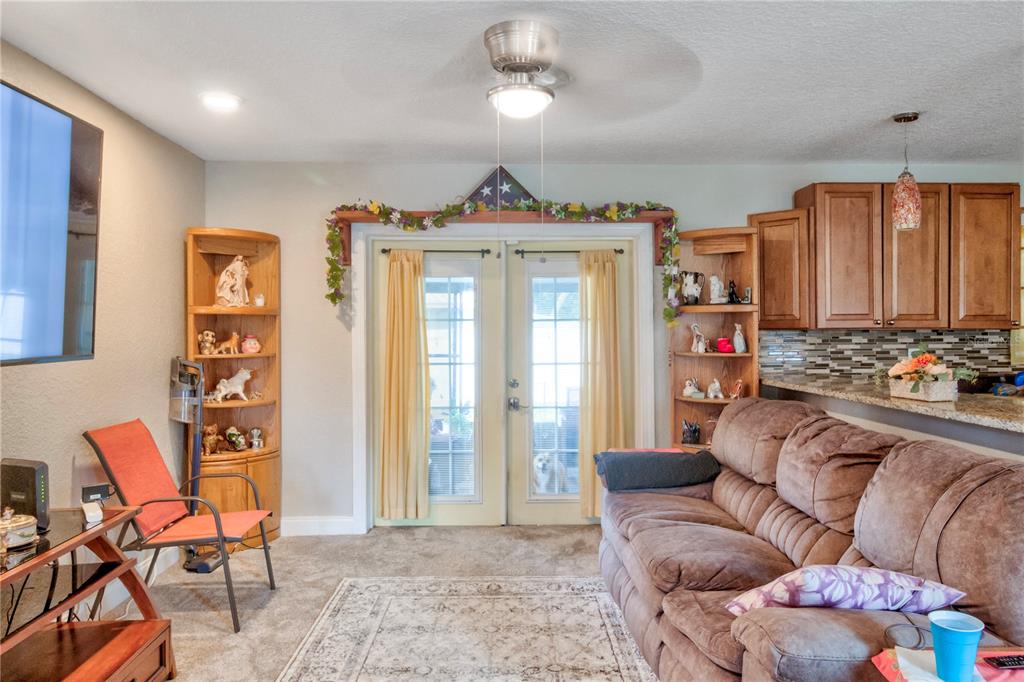 7367 Gates Circle Spring Hill, FL 34606 - Photo 8 of 31 a living room with furniture and a large window