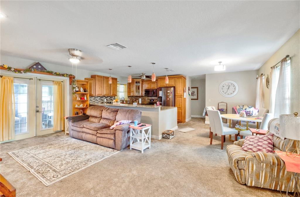 7367 Gates Circle Spring Hill, FL 34606 - Photo 9 of 31 a living room with furniture and a large window