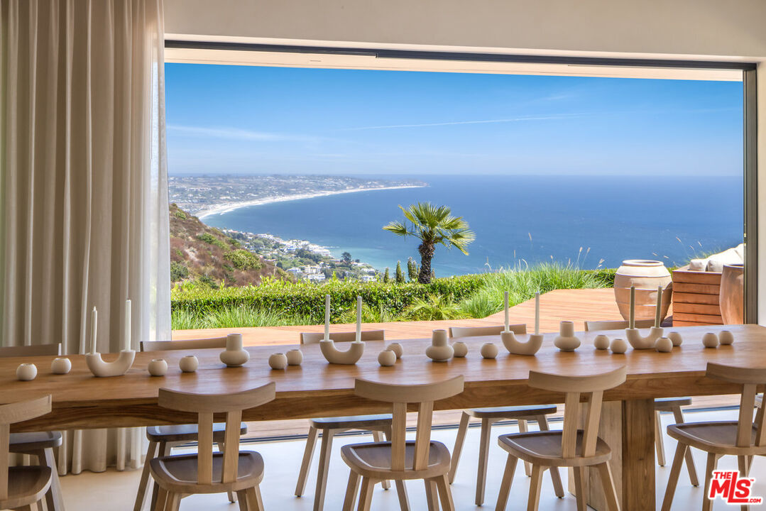 4310 Encinal Canyon Road Malibu, CA 90265 - Photo 7 of 28 a view of a dining room with furniture and window