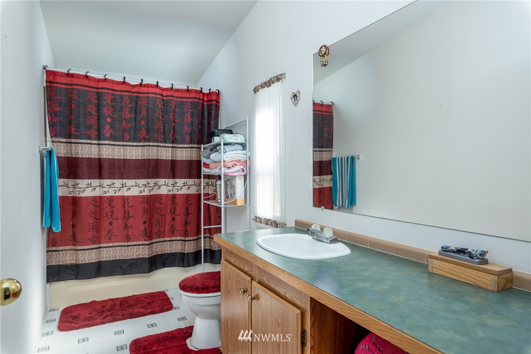 1410 Nooksack Road Everson, WA 98276 - Photo 5 of 26 a bathroom with a sink and a mirror