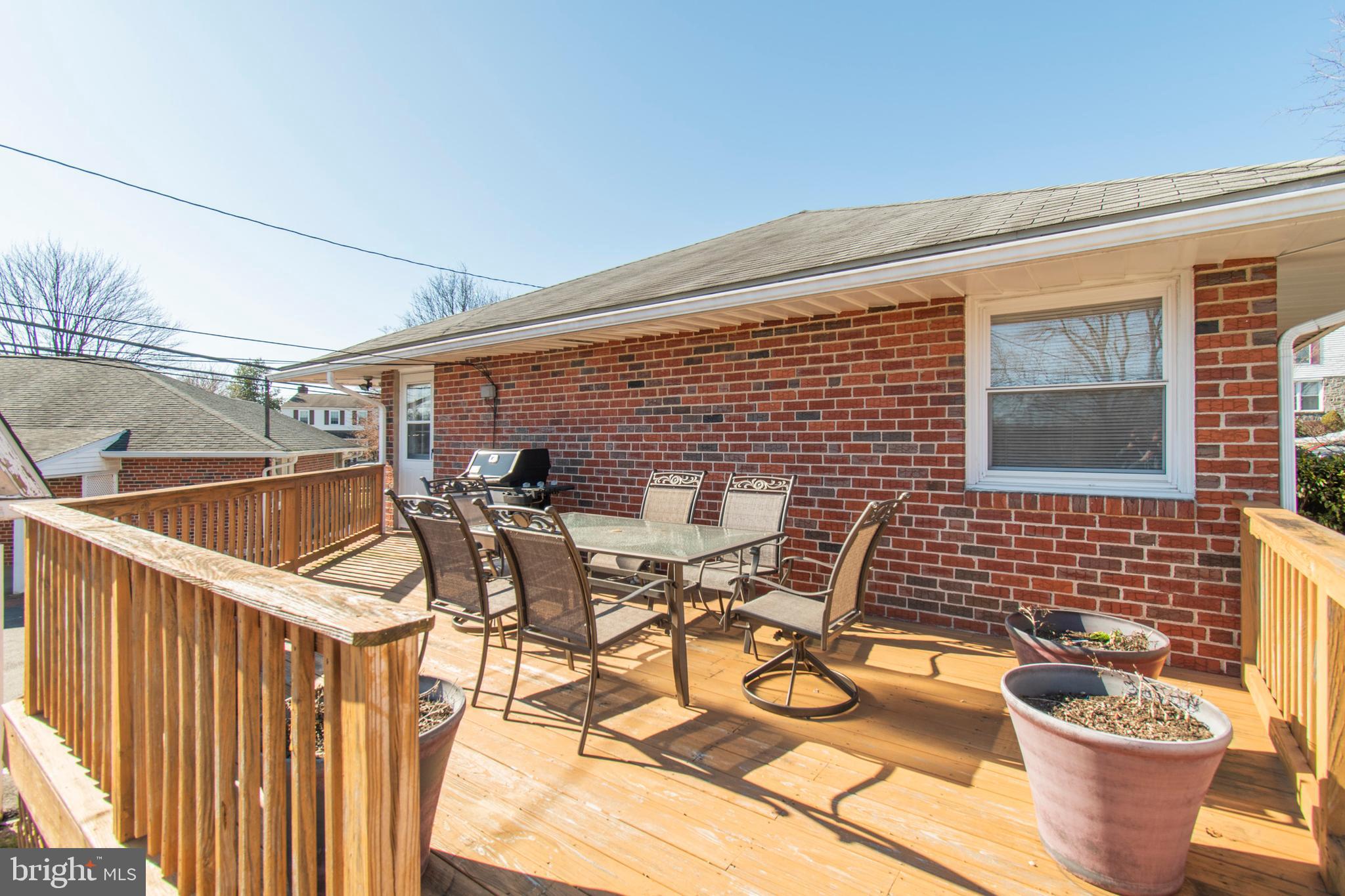 2333 Poplar Road Havertown, PA 19083 - Photo 35 of 38 a view of a patio with table and chairs and barbeque oven