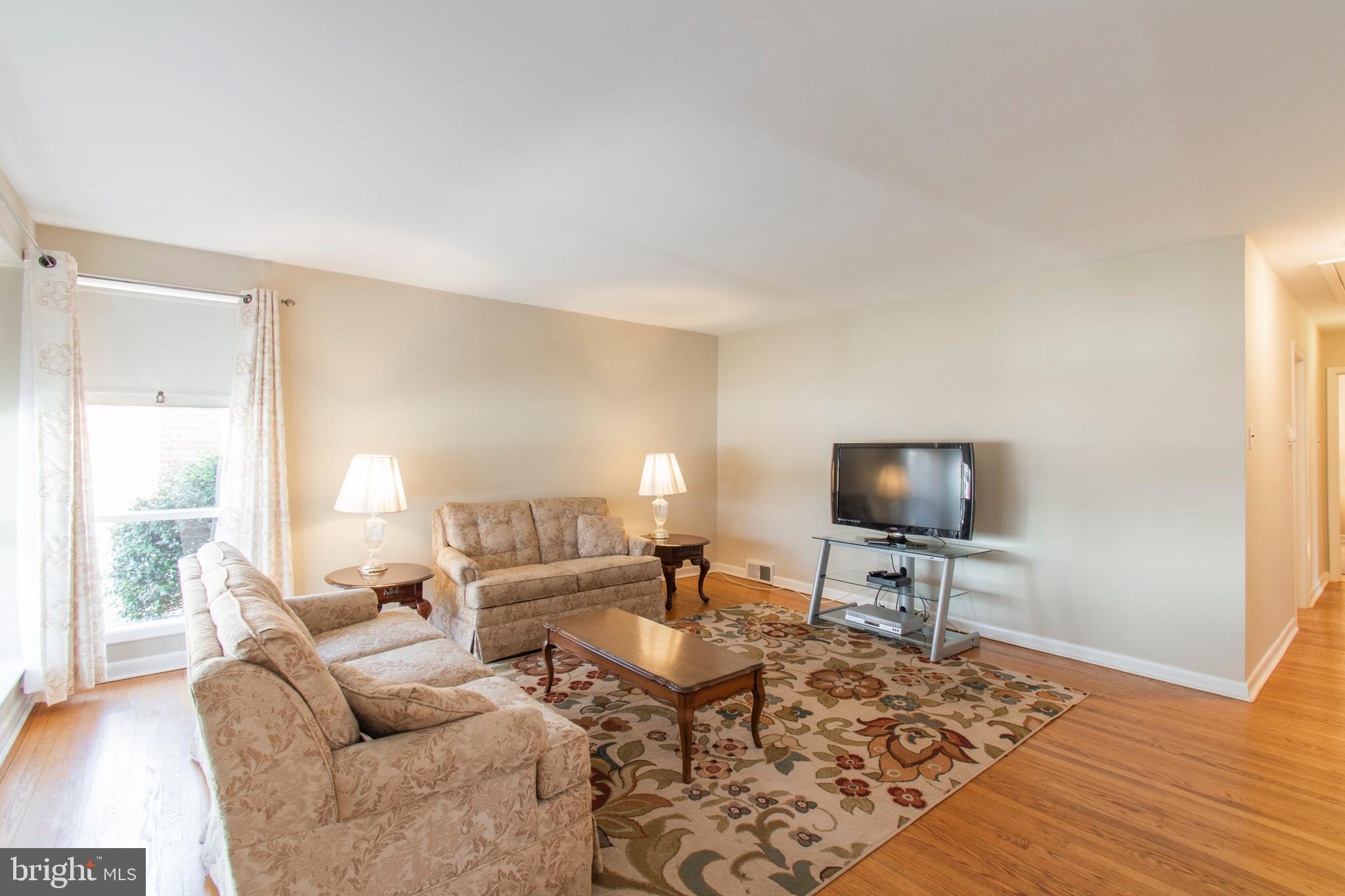 2333 Poplar Road Havertown, PA 19083 - Photo 5 of 38 a living room with furniture a rug and a flat screen tv