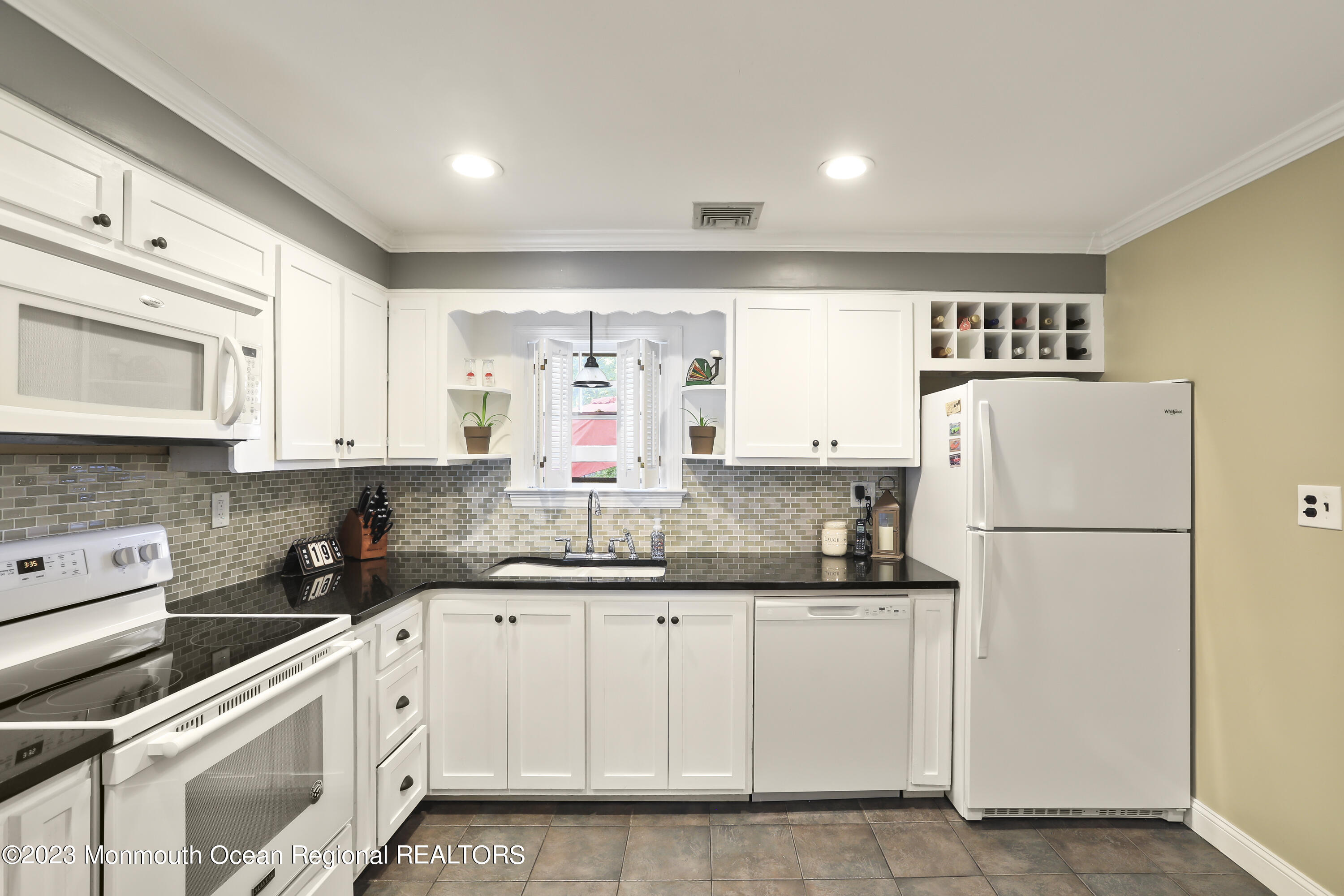 7 Burtina Place Keyport, NJ 07735 - Photo 14 of 29 a kitchen with cabinets appliances a sink and a window