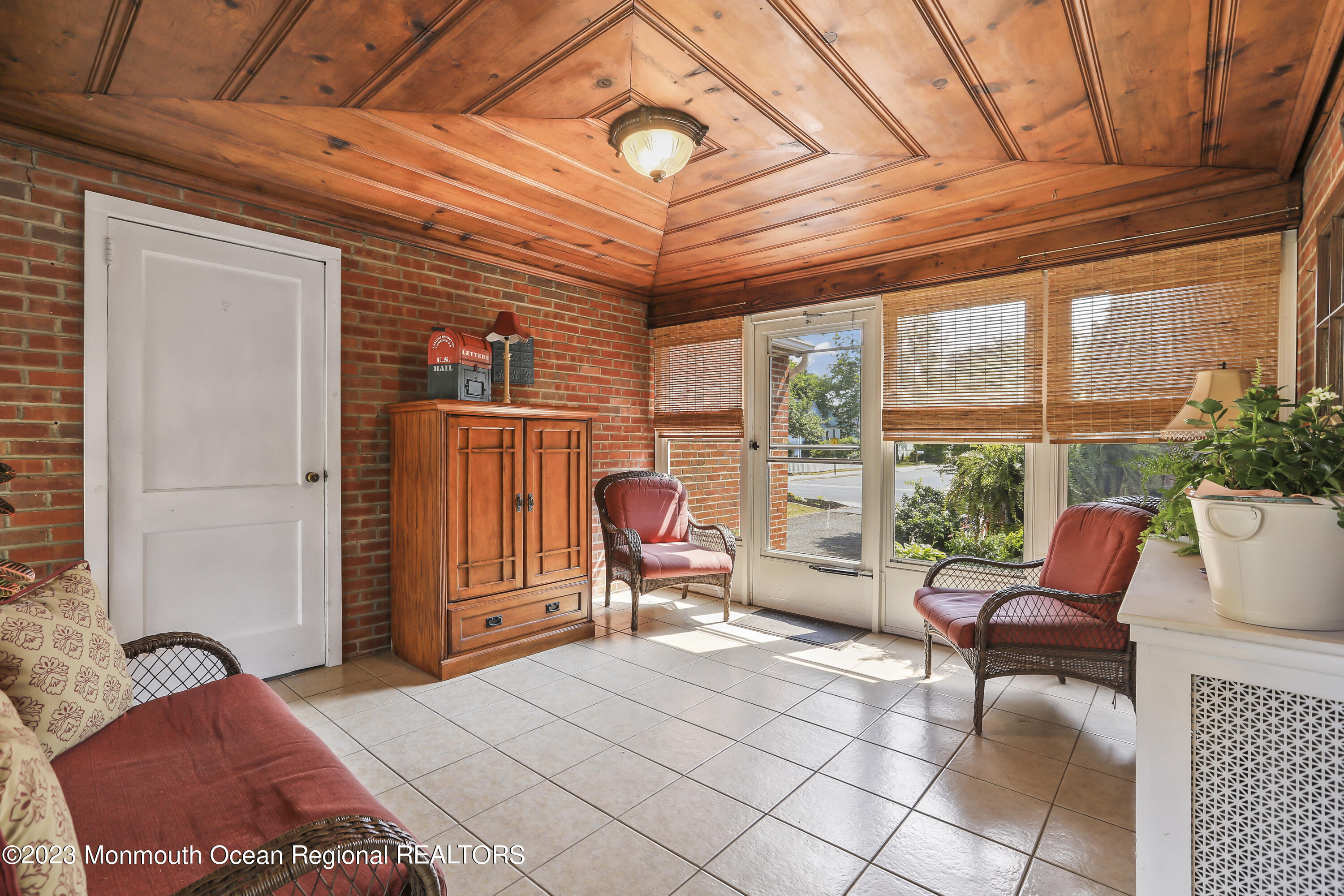 7 Burtina Place Keyport, NJ 07735 - Photo 16 of 29 a outdoor space with the couches and dining table under an umbrella