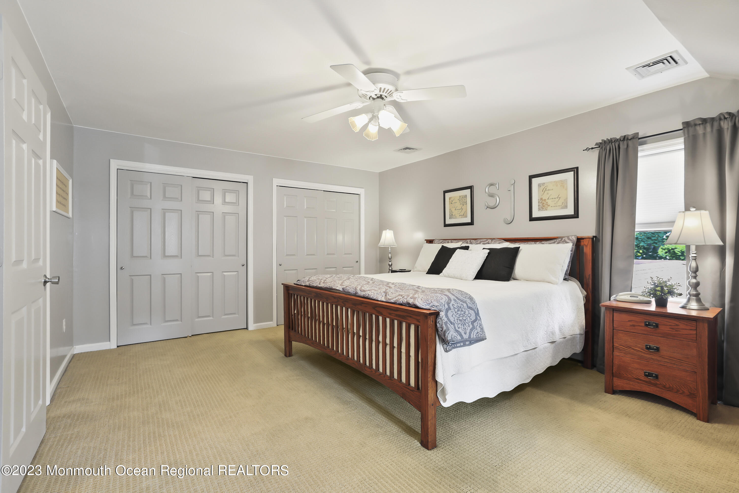 7 Burtina Place Keyport, NJ 07735 - Photo 19 of 29 a bedroom with a bed and a chandelier