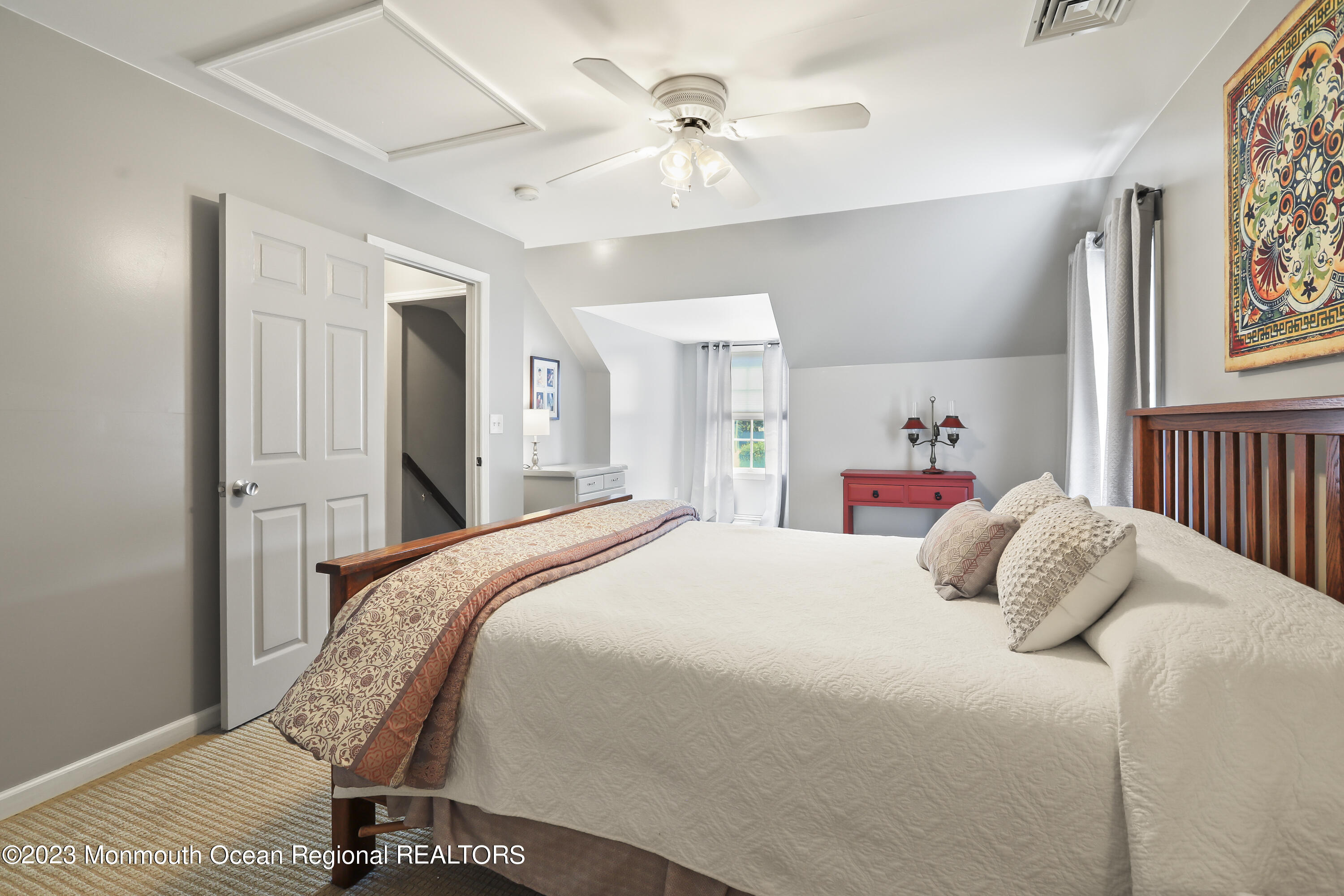 7 Burtina Place Keyport, NJ 07735 - Photo 22 of 29 a bedroom with a bed and a chandelier