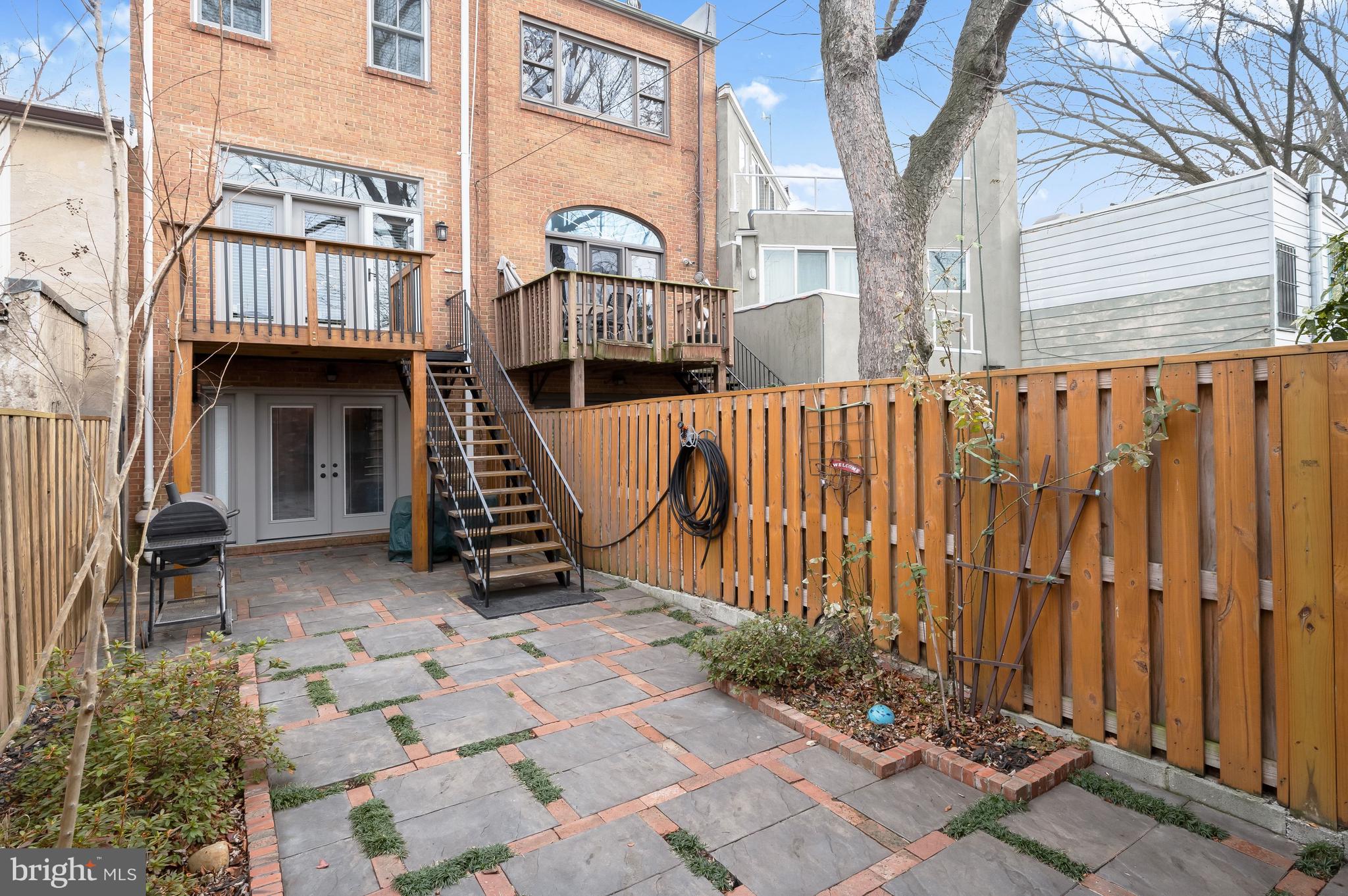 237 10th Street Southeast Washington, DC 20003 - Photo 30 of 40 a view of a house with a wooden fence