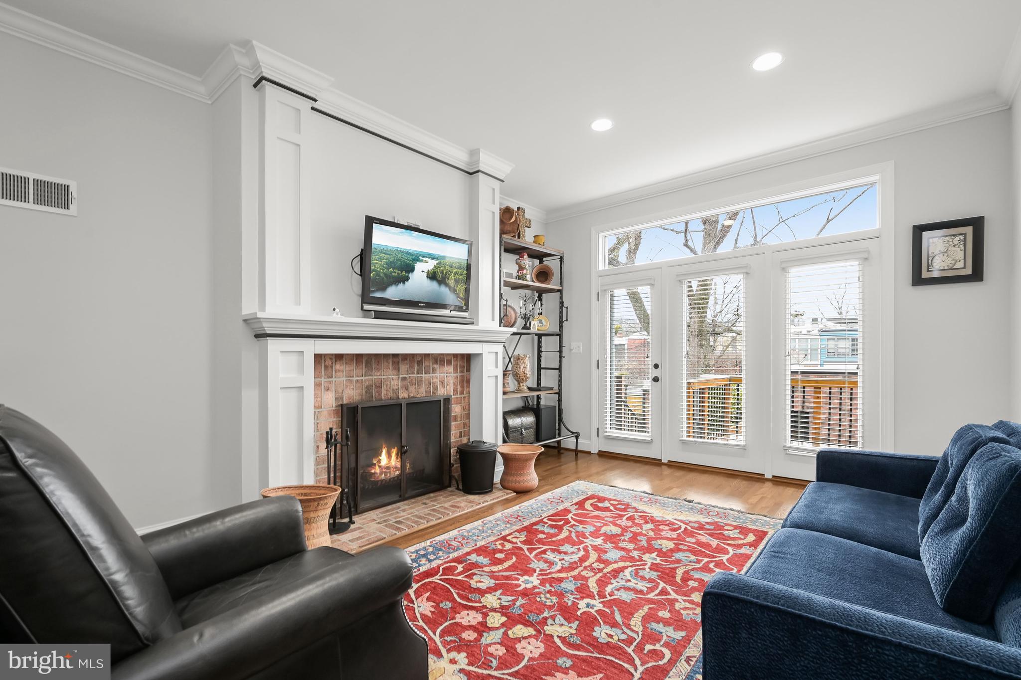 237 10th Street Southeast Washington, DC 20003 - Photo 7 of 40 a living room with furniture and a fireplace