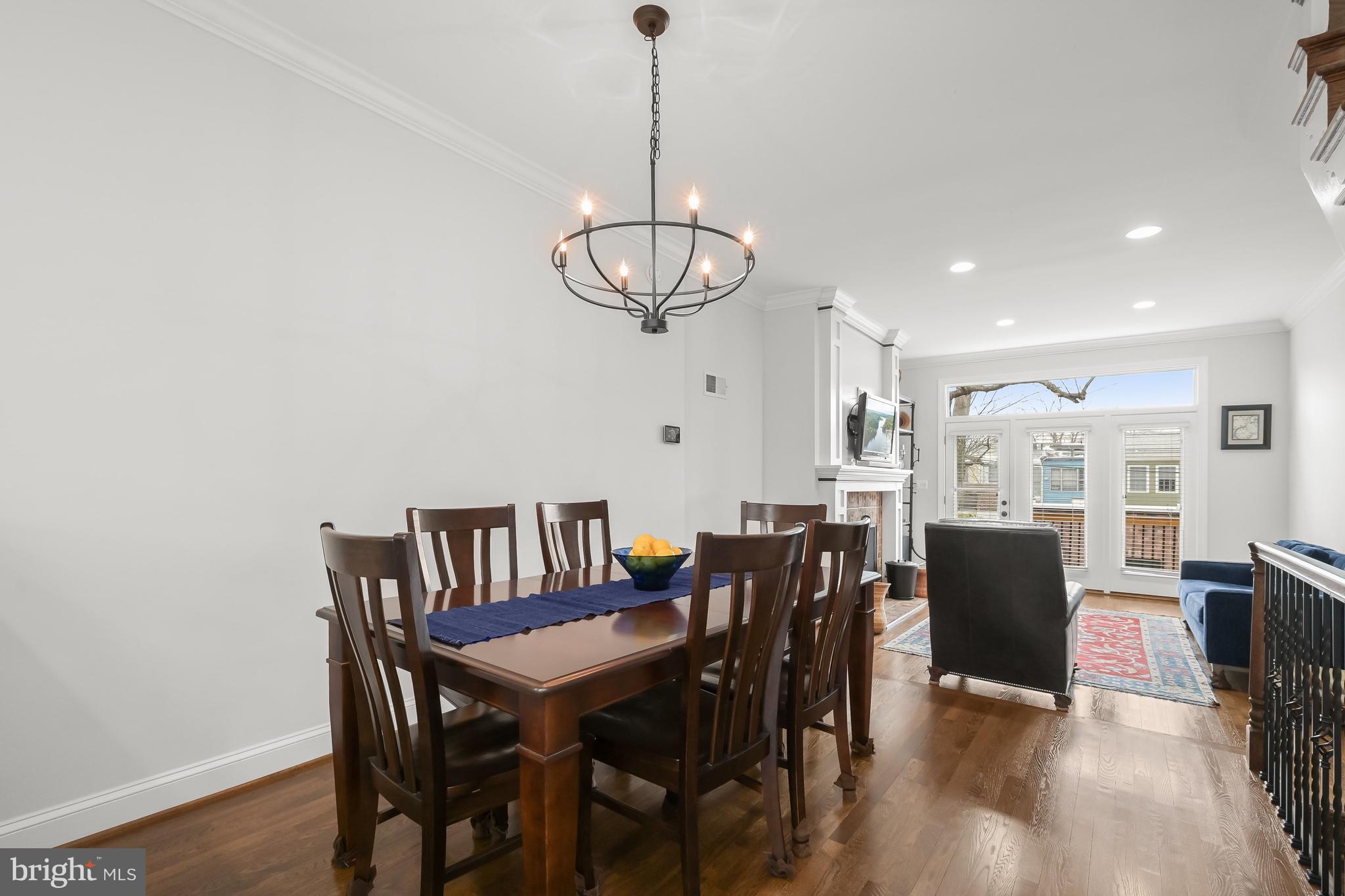237 10th Street Southeast Washington, DC 20003 - Photo 8 of 40 a view of a dining room with furniture window and wooden floor