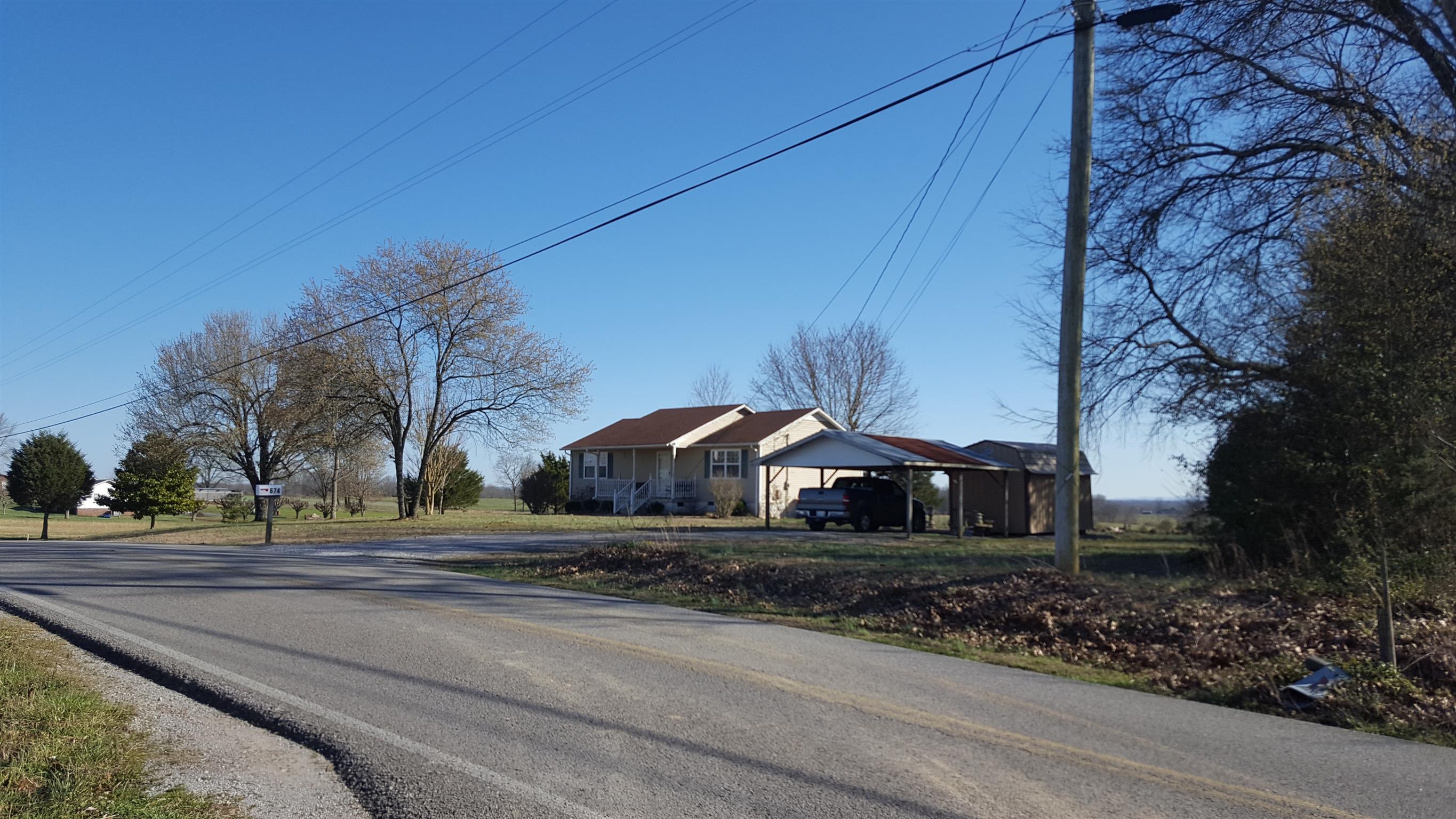 640 4 Seasons Road Smithville, TN 37166 - Photo 6 of 7 Left side neighbor and street view.