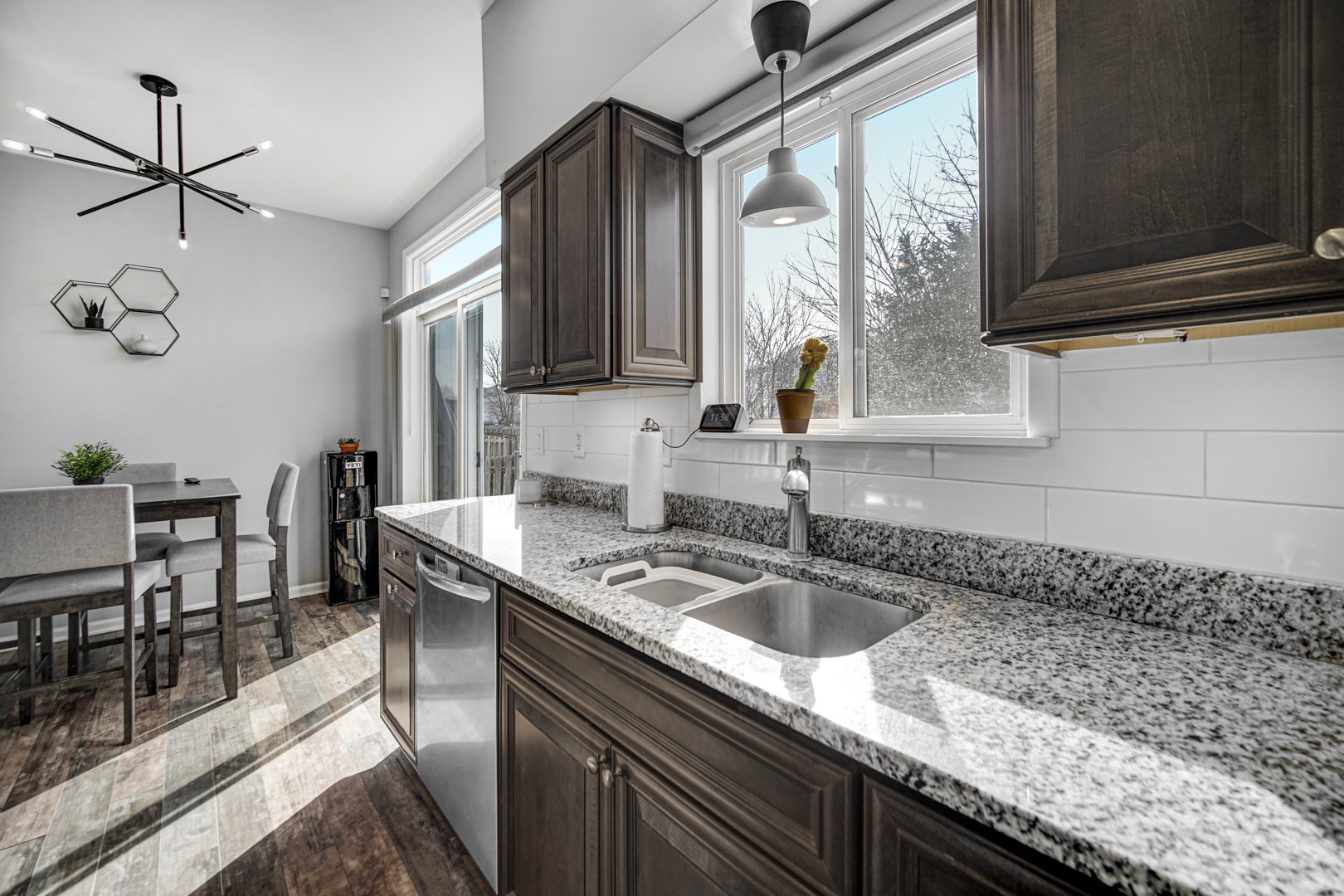 1741 Raleigh Trail Romeoville, IL 60446 - Photo 11 of 20 a kitchen with granite countertop a sink a stove and cabinets
