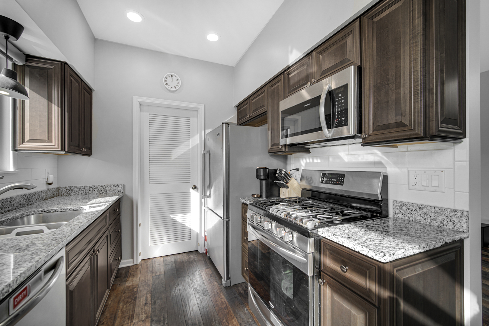 1741 Raleigh Trail Romeoville, IL 60446 - Photo 9 of 20 a kitchen with stainless steel appliances granite countertop a stove microwave and refrigerator