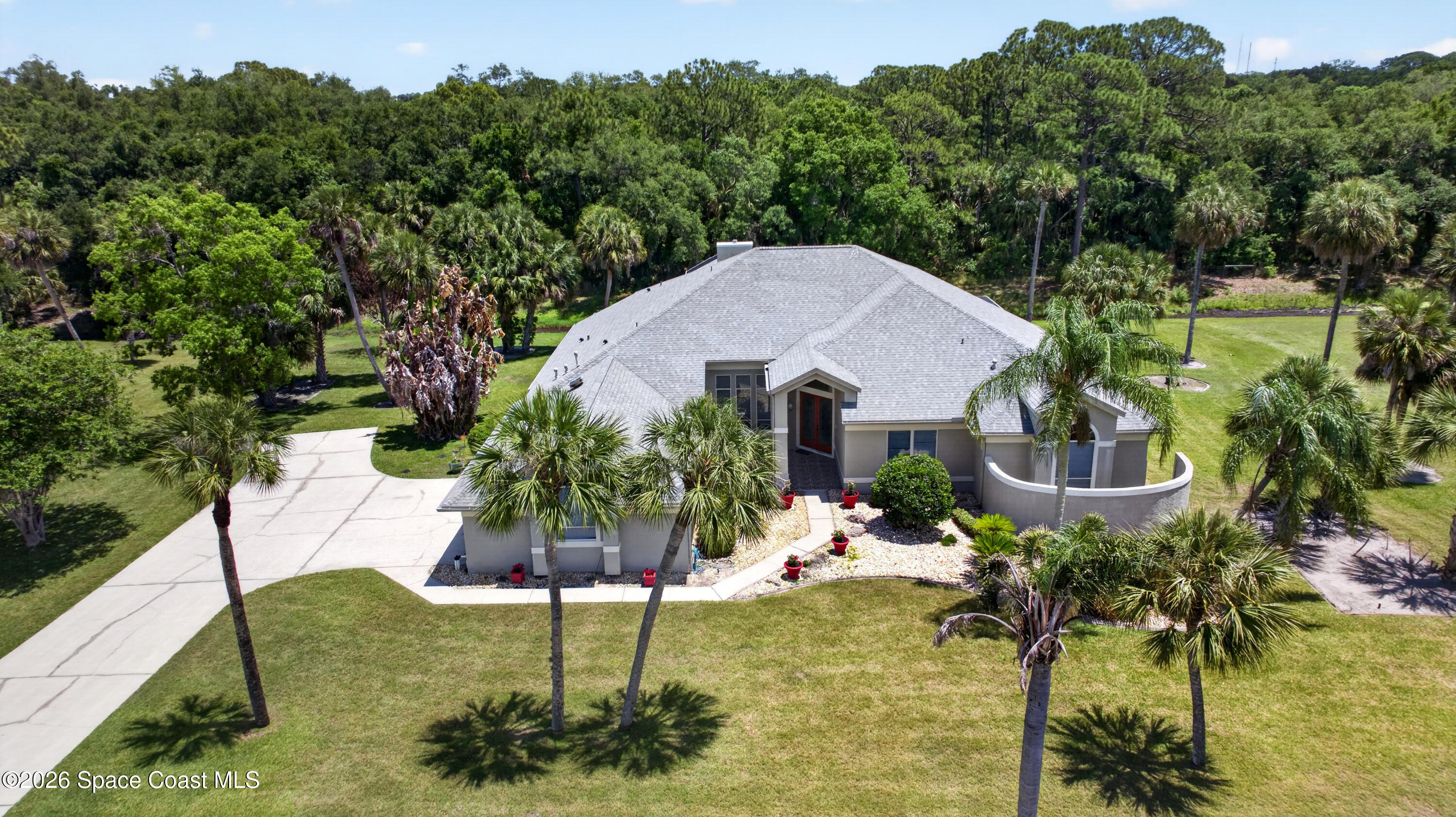 900 Bluegrass Lane Rockledge, FL 32955 - Photo 2 of 73 DJI_20260428140737_0013_D
