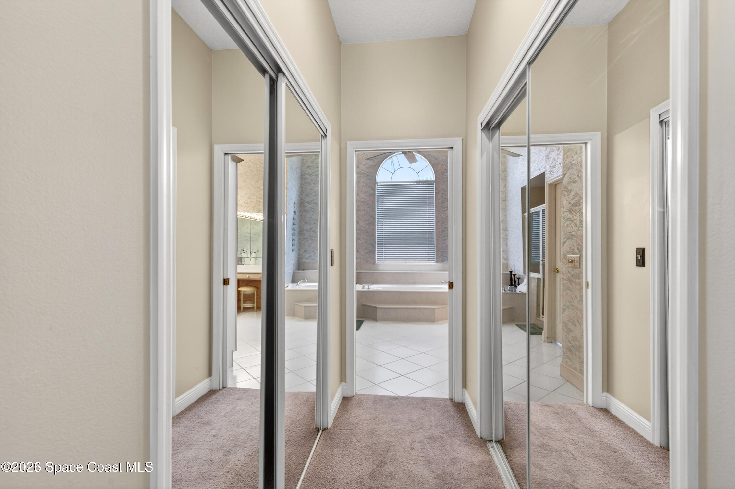 900 Bluegrass Lane Rockledge, FL 32955 - Photo 41 of 73 Double Closets Entering Primary Bath