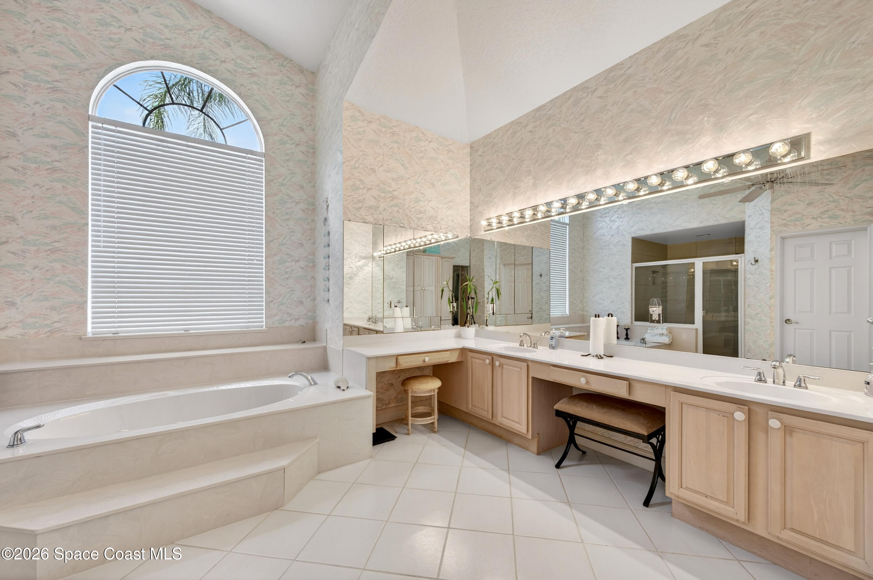 900 Bluegrass Lane Rockledge, FL 32955 - Photo 42 of 73 Primary Bath Tub and Vanity