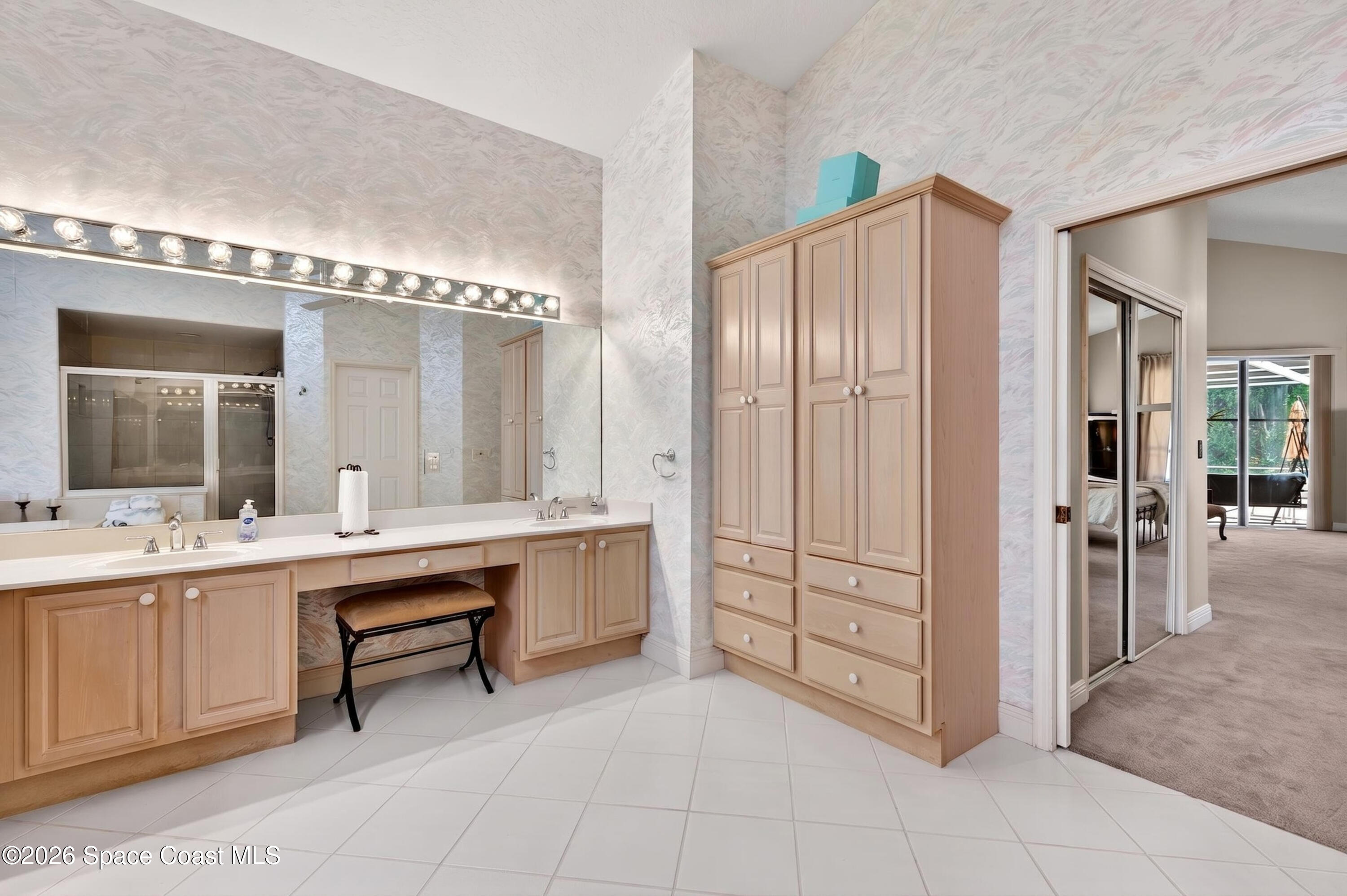 900 Bluegrass Lane Rockledge, FL 32955 - Photo 44 of 73 Primary Vanity and Built-In Linen