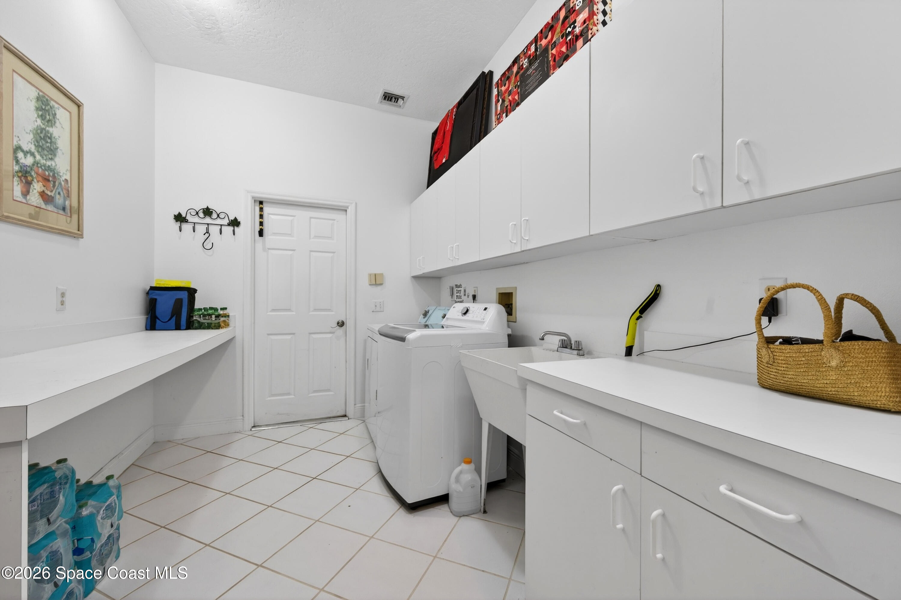 900 Bluegrass Lane Rockledge, FL 32955 - Photo 52 of 73 Massive Laundry Room with Sink