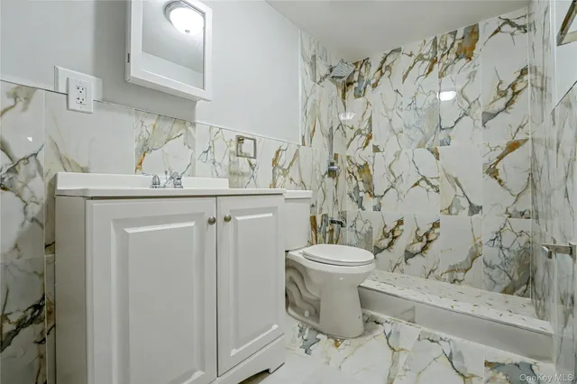 a bathroom with a toilet and a sink