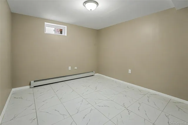 an empty room with white walls