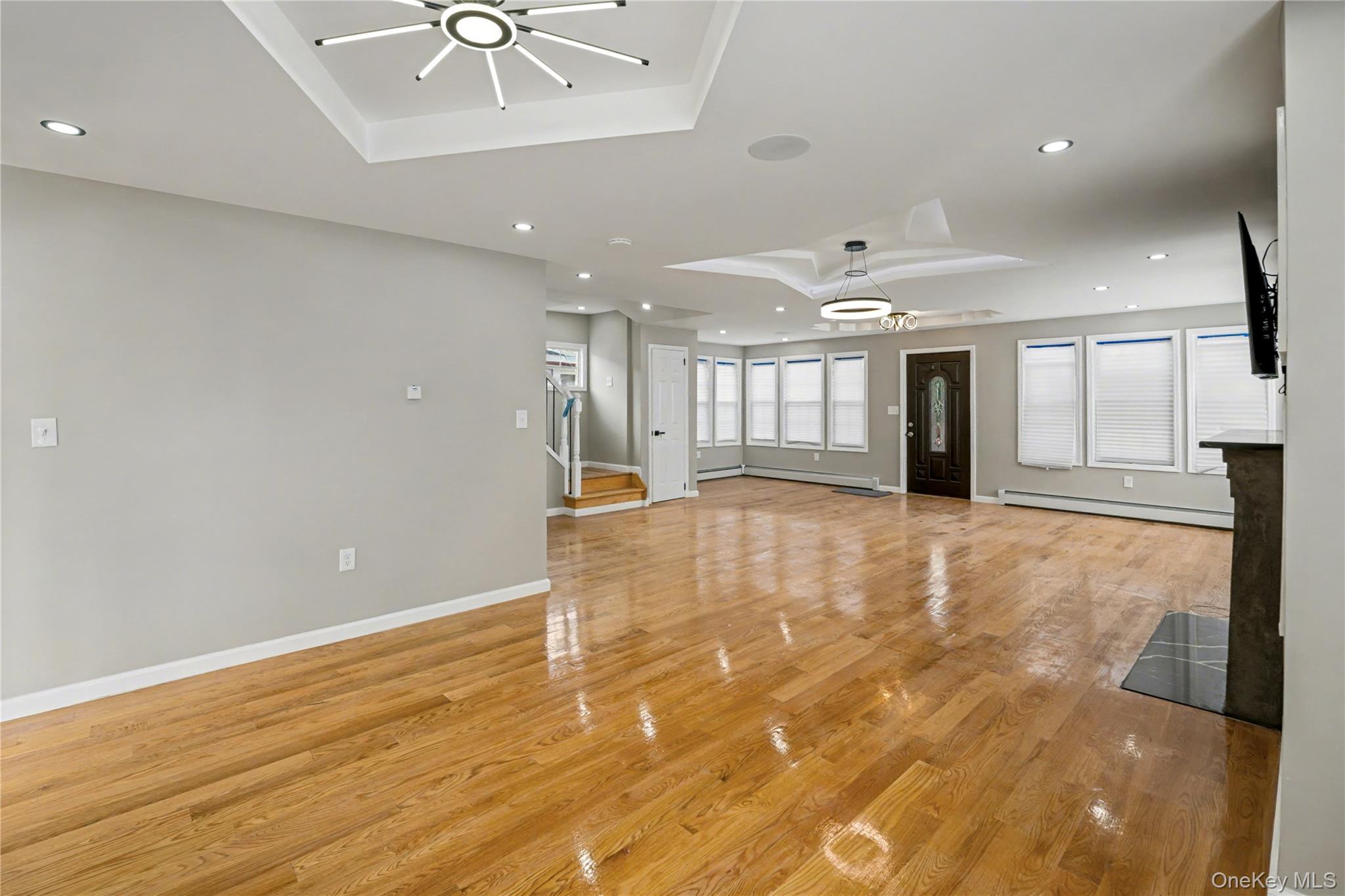 104-40 194th Street Queens, NY 11412 - Photo 3 of 18 a view of an empty room with a window