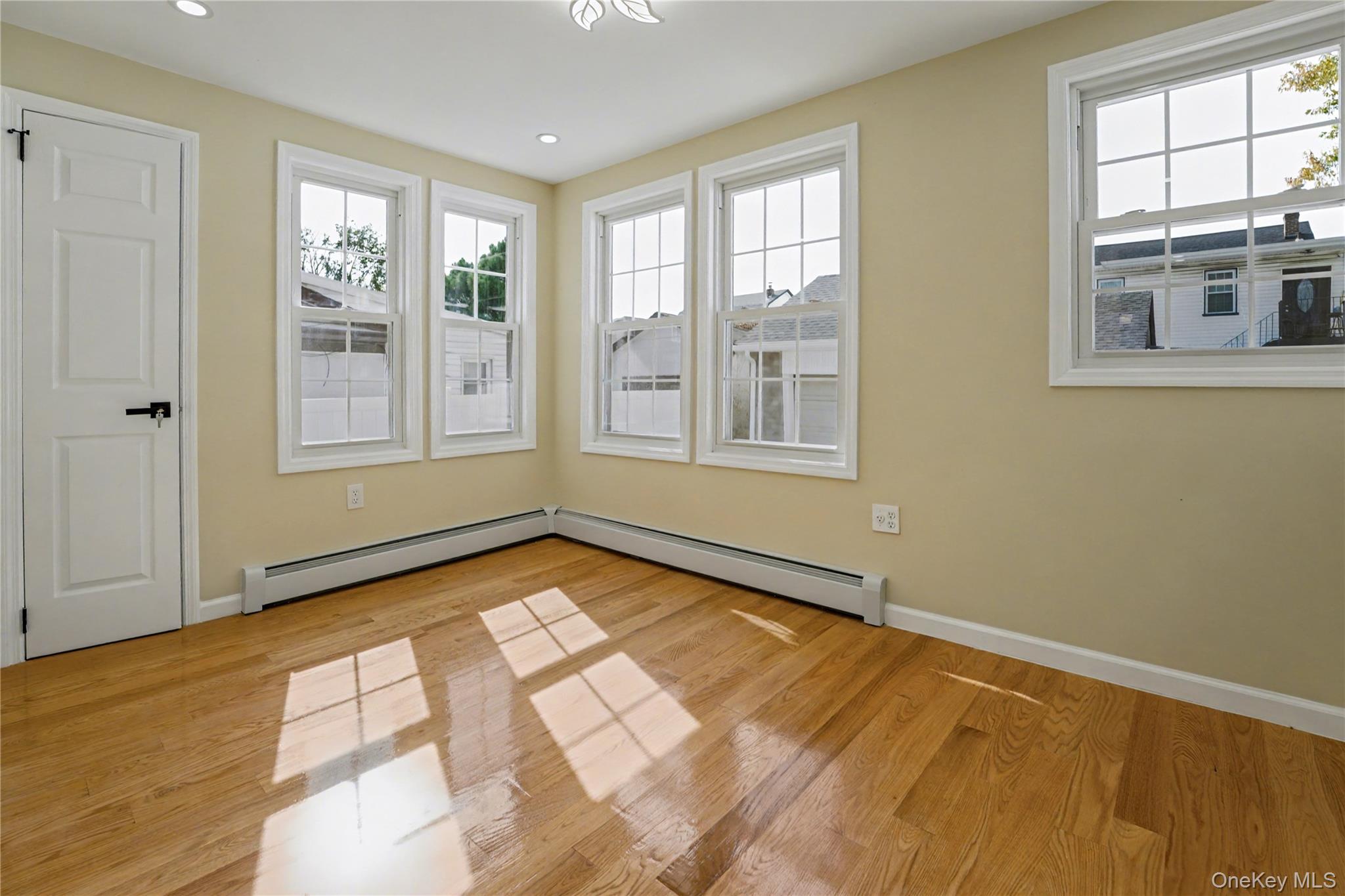 104-40 194th Street Queens, NY 11412 - Photo 8 of 18 a view of an empty room with a window