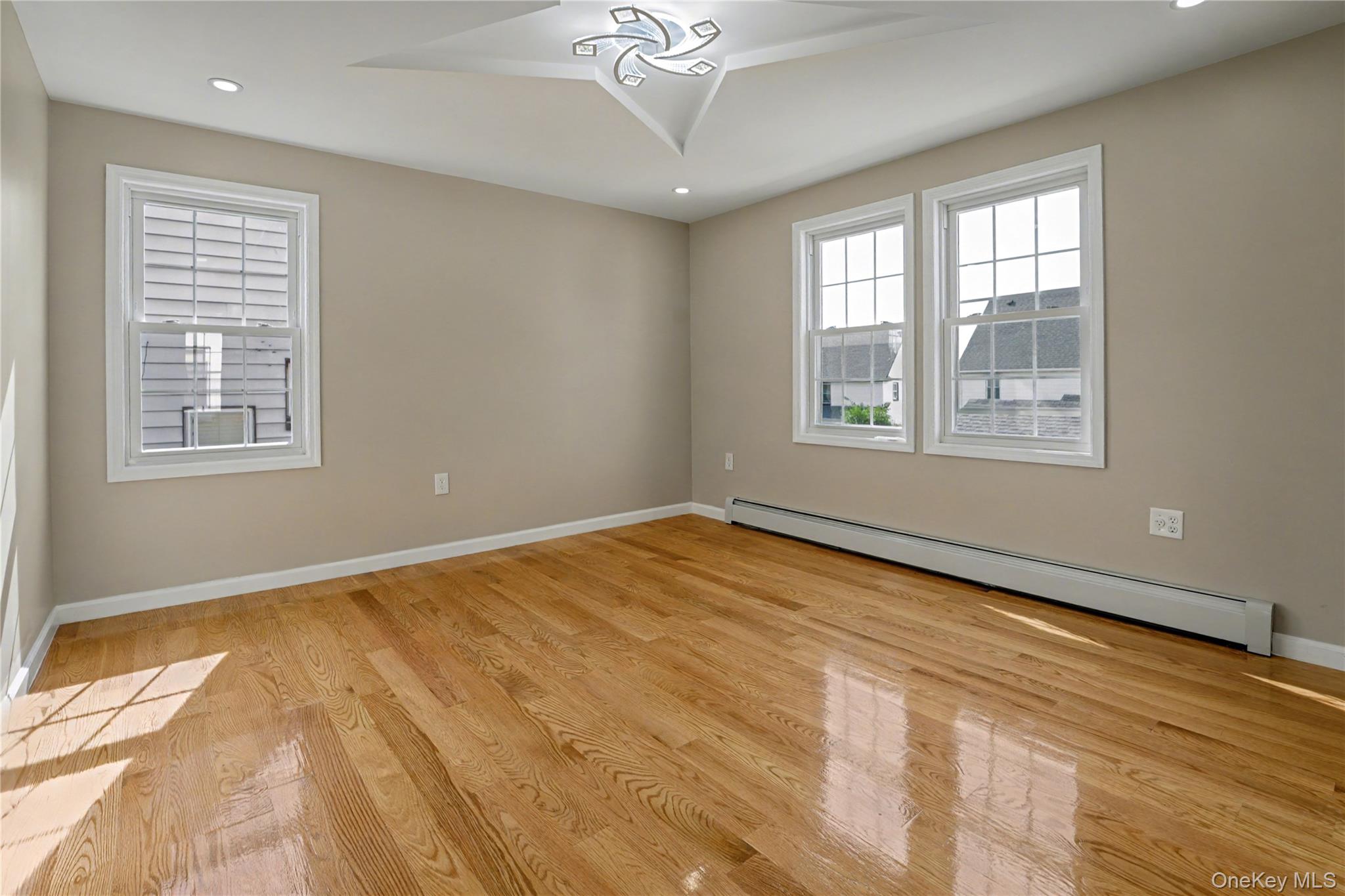 104-40 194th Street Queens, NY 11412 - Photo 9 of 18 a view of an empty room with a window