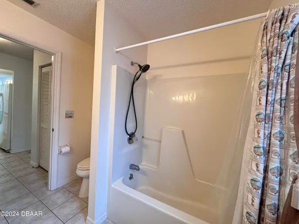 a view of an empty room with windows