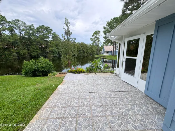 a view of a backyard of the house