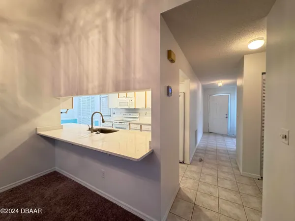 a bathroom with a sink a mirror and a shower
