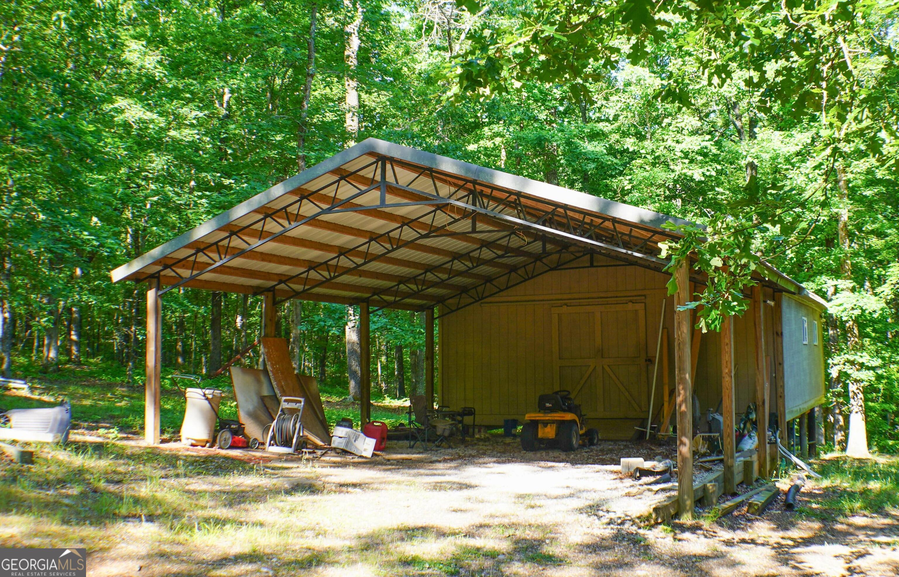 335 Winding Stream Trail Hampton, GA 30228 - Photo 32 of 35 a view of outdoor space yard and porch