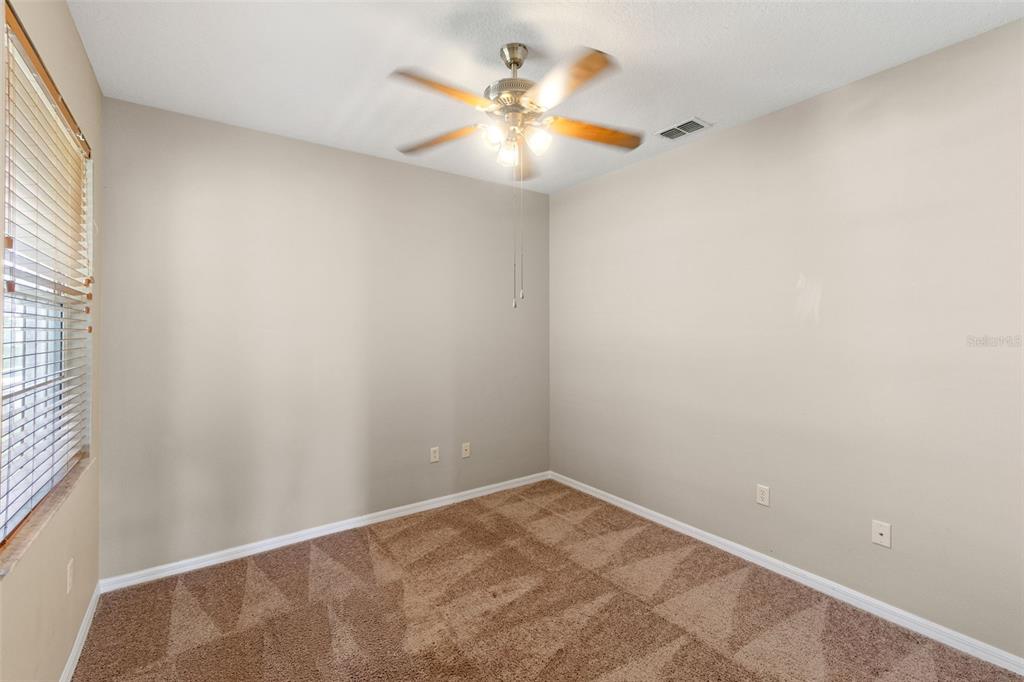 890 Summit Greens Boulevard Clermont, FL 34711 - Photo 28 of 62 a view of an empty room and chandelier fan
