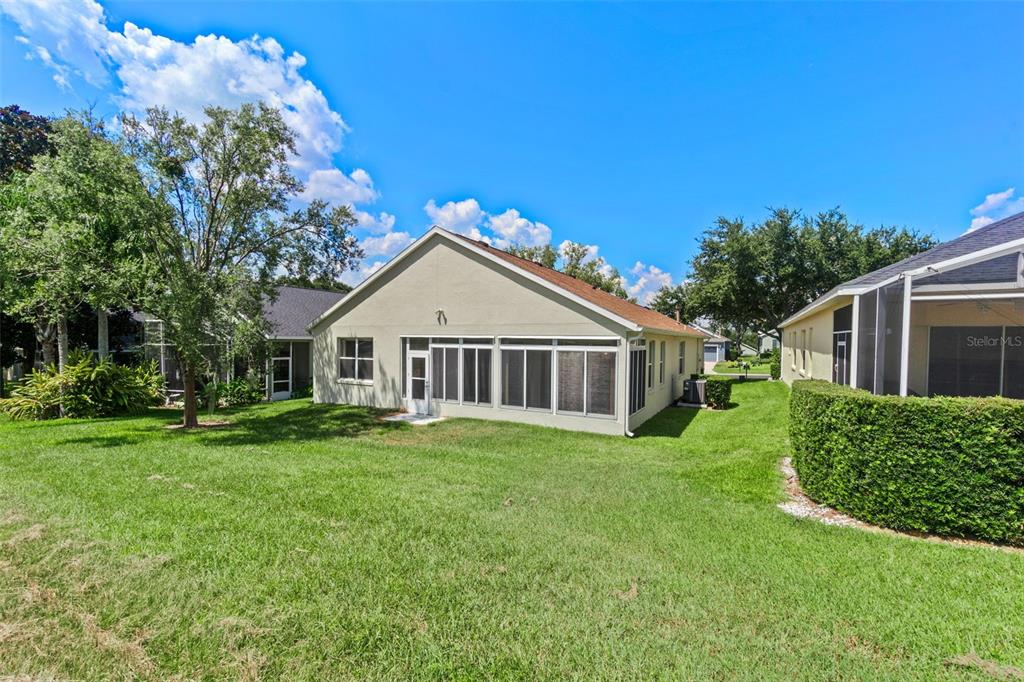 890 Summit Greens Boulevard Clermont, FL 34711 - Photo 39 of 62 a view of a house with a yard