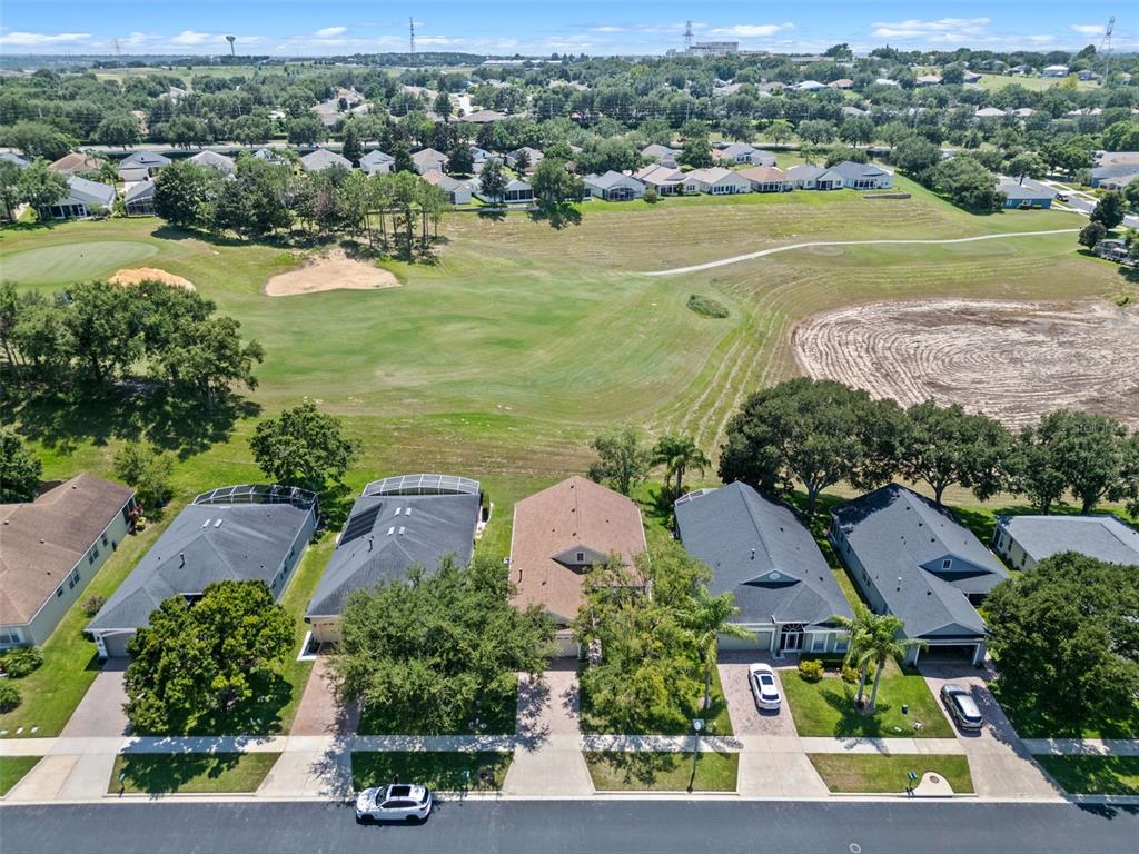 890 Summit Greens Boulevard Clermont, FL 34711 - Photo 41 of 62 an aerial view of a city with lots of residential buildings ocean and mountain view in back