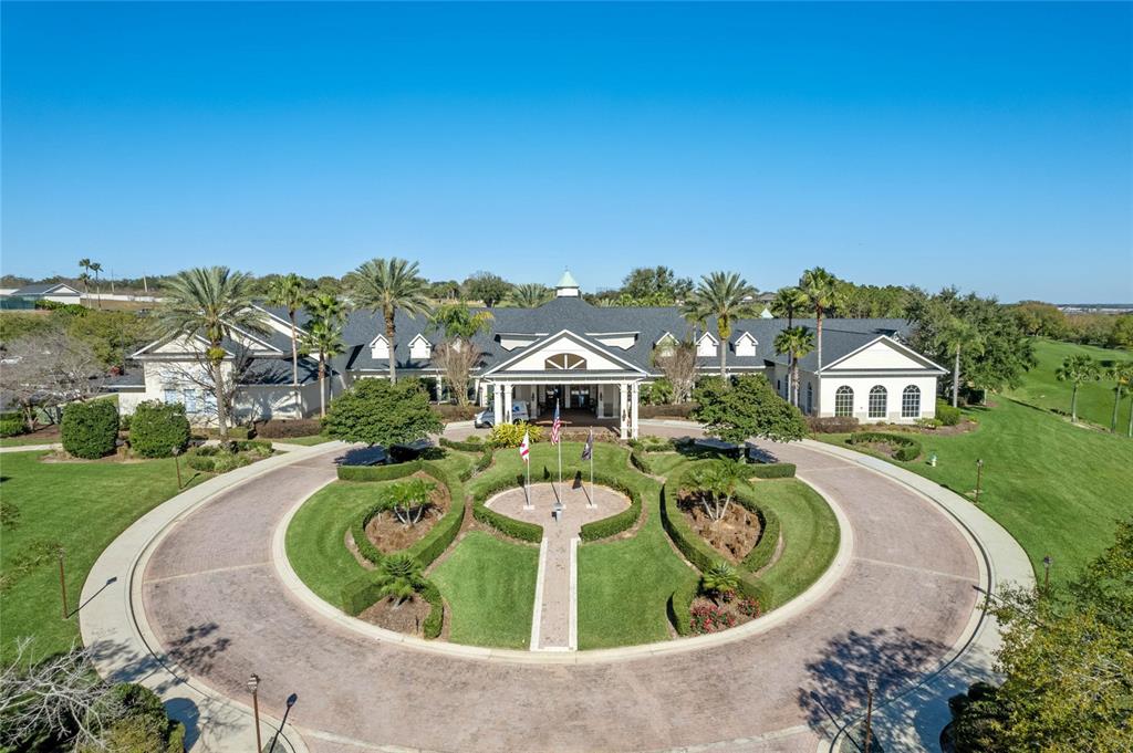 890 Summit Greens Boulevard Clermont, FL 34711 - Photo 45 of 62 an aerial view of a house with a swimming pool
