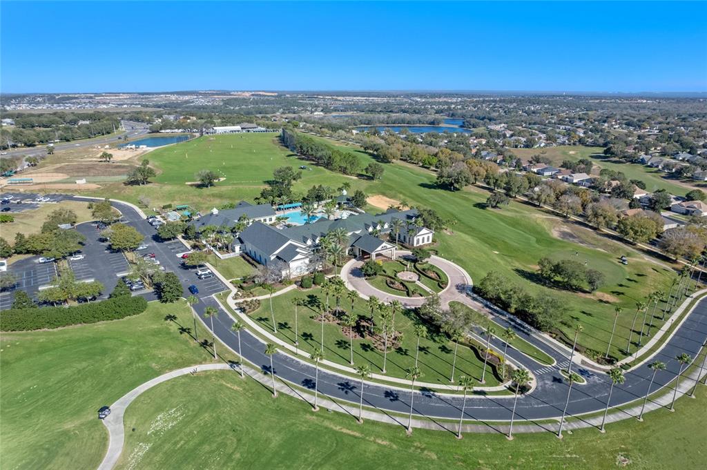 890 Summit Greens Boulevard Clermont, FL 34711 - Photo 46 of 62 a view of a swimming pool from a lake view