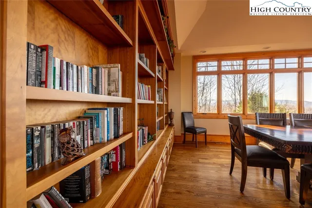 a view of a chairs and table in a balcony