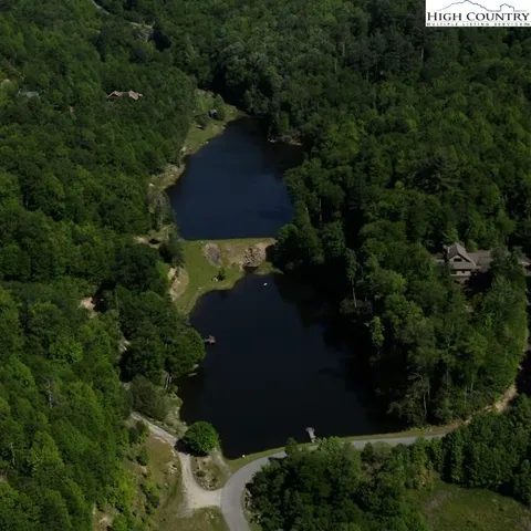 an aerial view of a house yard and outdoor seating