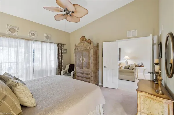 a spacious bathroom with a shower sink and mirror