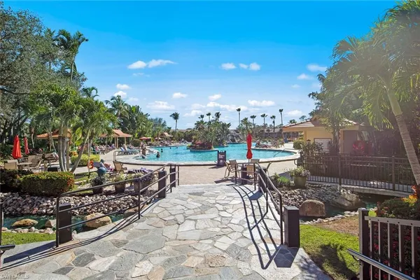 a view of a lake in a backyard