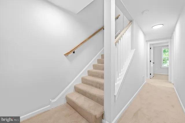 a view of staircase with white walls