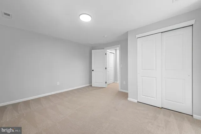a view of an empty room and entryway